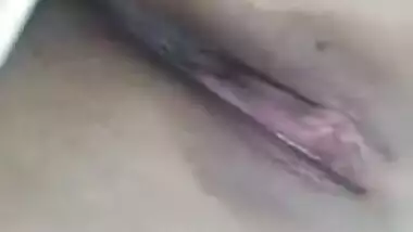 Risque Indian babe takes breasts and pussy out in a short porn video