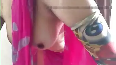 Defenseless Indian girl in a pink sari airs her sex melons in XXX video